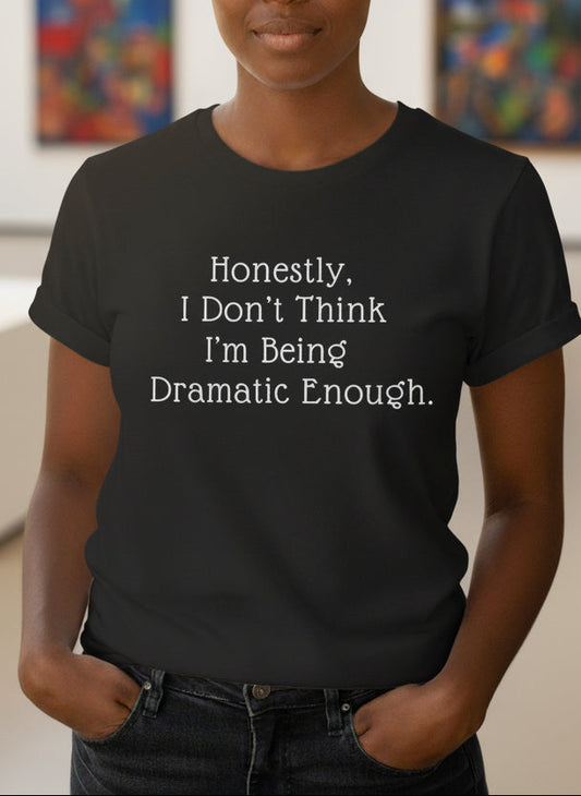 Person wearing a black t-shirt with text in an art gallery